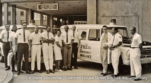 A photo taken in Pittsburgh on June 16, 1968, the first day of the Freedom House Ambulance Service, showing EMTs standing in front of an ambulance.