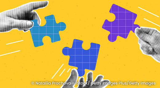 Graphic of hands holding puzzle pieces.