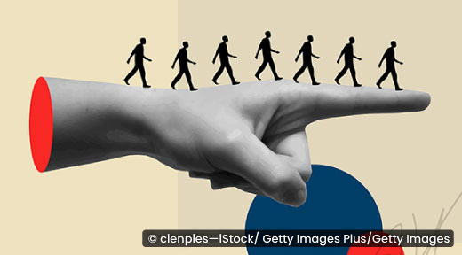 Graphic of a pointing hand with silhouette of people walking in the same direction.