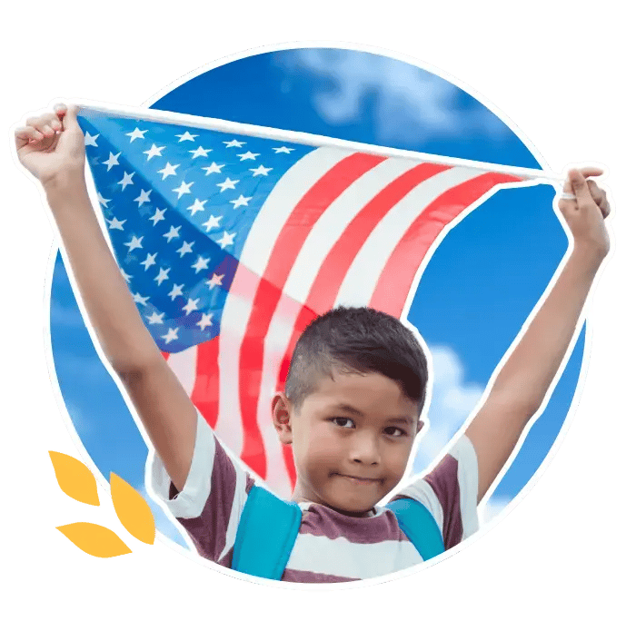a boy holding an american flag